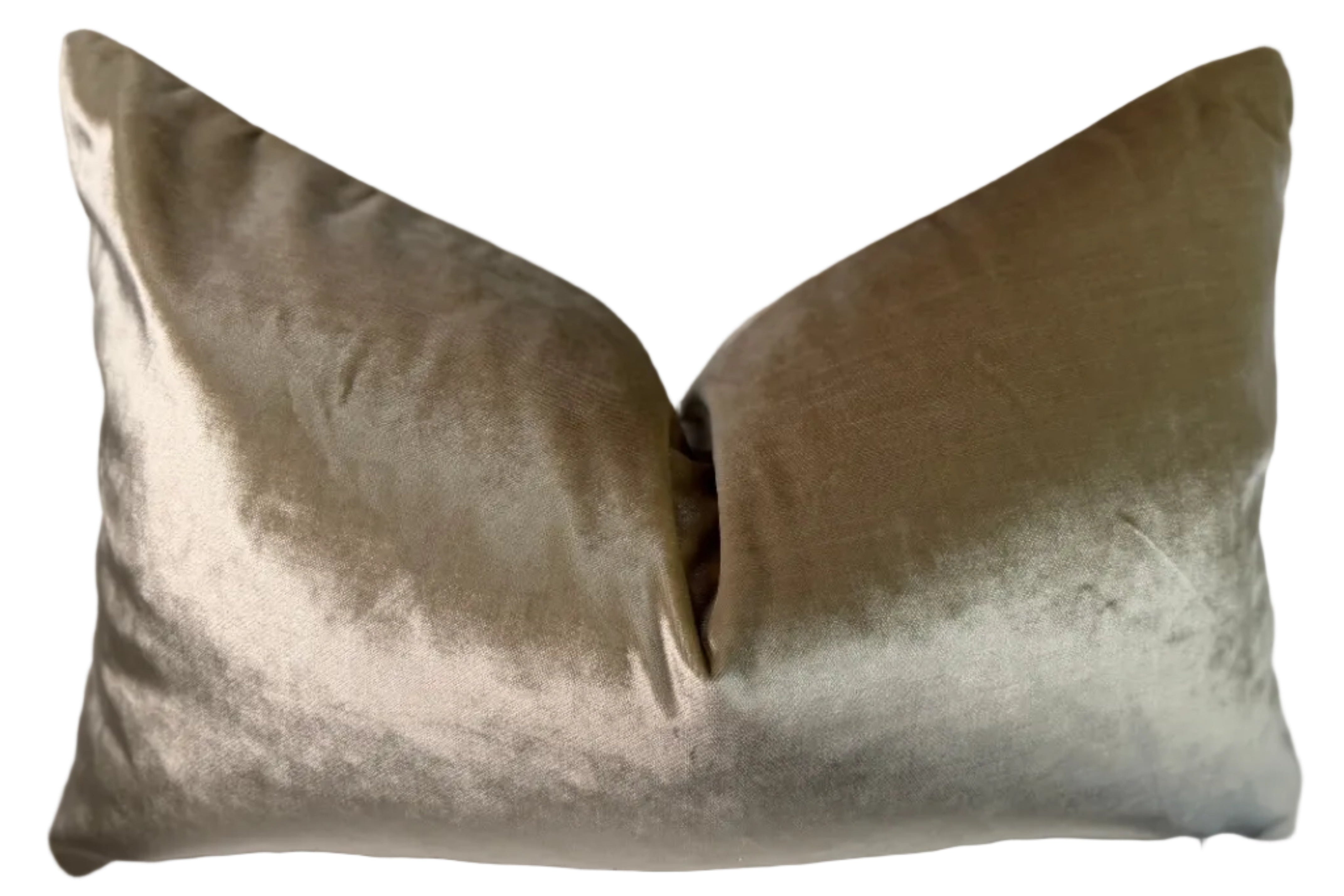 two sided lumbar pillow where back side is a solid gold velvet like material